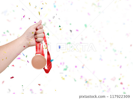 holding a bronze coin Celebrate success 117922309