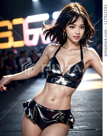 Female dancer performing live in a studio with an audience 117922581