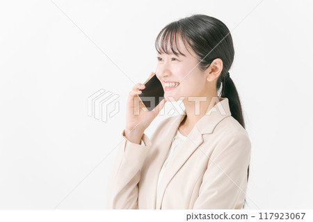 Business woman making a phone call Business woman making a phone call 117923067