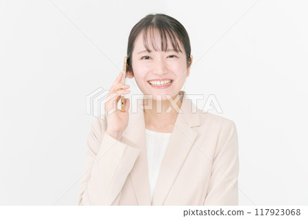 Business woman making a phone call Business woman making a phone call 117923068
