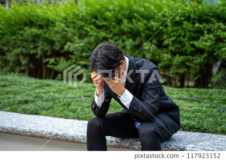 depressed businessman depressed businessman 117923152