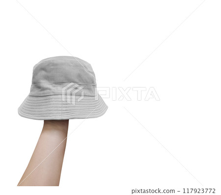 white bucket hat on hand Isolated on a white background white bucket hat on hand Isolated on a white background 117923772