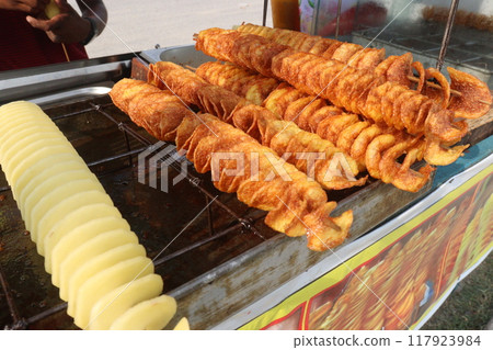 Spiral Fried Potato with stick on shop Spiral Fried Potato with stick on shop 117923984