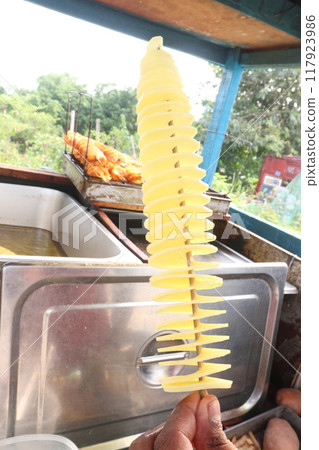 Spiral Fried Potato with stick on shop Spiral Fried Potato with stick on shop 117923986