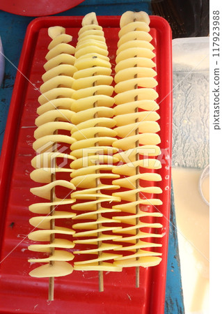 Spiral Fried Potato with stick on shop Spiral Fried Potato with stick on shop 117923988