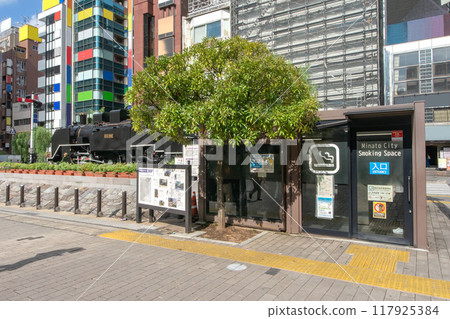 Smoking area and steam locomotive at the SL Plaza at the west exit of Shinbashi Station, Minato Ward, Tokyo Smoking area and steam locomotive at the SL Plaza at the west exit of Shinbashi Station, Minato Ward, Tokyo 117925384