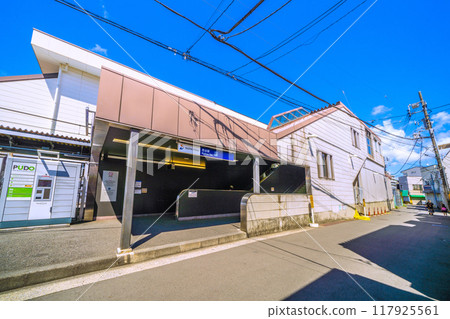 Yokohama cityscape, Japan, August. View of the south exit of SOTETSU Nishiya Station. There are parcel lockers next to the entrance. 117925561