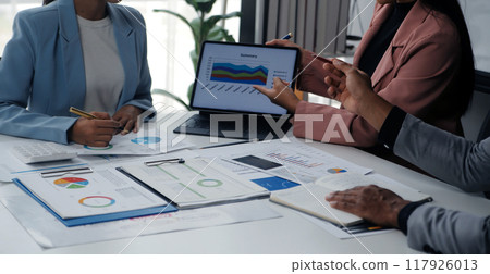 Close up of Business team analyzing income charts and graphs with modern laptop computer. Business analysis and strategy concept. Close up of Business team analyzing income charts and graphs with modern laptop computer. Business analysis and strategy concept. 117926013