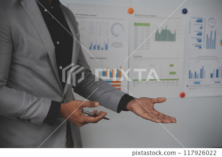 Close up of Business team analyzing income charts and graphs with modern laptop computer. Business analysis and strategy concept. Close up of Business team analyzing income charts and graphs with modern laptop computer. Business analysis and strategy concept. 117926022