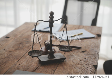 Judge gavel with Justice lawyers having team meeting at law firm background. Concepts of Law and Legal services. Judge gavel with Justice lawyers having team meeting at law firm background. Concepts of Law and Legal services. 117926041