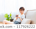 Woman in loungewear relaxing on sofa / Holiday morning / Relaxing 117926222