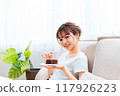 Woman in loungewear relaxing on sofa / Holiday morning / Relaxing 117926223
