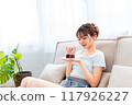 Woman in loungewear relaxing on sofa / Holiday morning / Relaxing 117926227