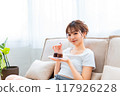 Woman in loungewear relaxing on sofa / Holiday morning / Relaxing 117926228