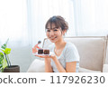 Woman in loungewear relaxing on sofa / Holiday morning / Relaxing 117926230