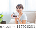 Woman in loungewear relaxing on sofa / Holiday morning / Relaxing 117926231