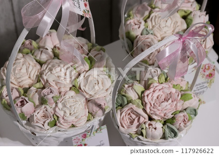 Three boxes of homemade marshmallows. Tied with a ribbon. The tags have the inscription in Russian Thank you for your invaluable work  Flowers made of marshmallow. Close up. 117926622