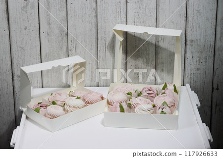 Homemade marshmallows in an open boxes. Marshmallow flowers. Homemade marshmallows in an open boxes. Marshmallow flowers. 117926633