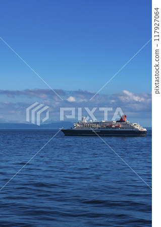 The passenger ship Nippon Maru sails ahead with Kunashiri Island in the background. The passenger ship Nippon Maru sails ahead with Kunashiri Island in the background. 117927064