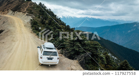 Driving off road car in high altitude mountains in tibet, China 117927558