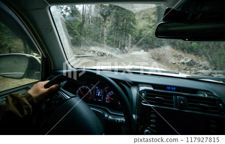 Driving off road car in high altitude mountains in China 117927815
