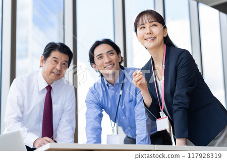 Businessmen having a meeting. Photo courtesy of Denpa Gakuen, Tokyo Electronics College. 117928319