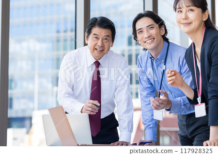 Businessmen having a meeting. Photo courtesy of Denpa Gakuen, Tokyo Electronics College. Businessmen having a meeting. Photo courtesy of Denpa Gakuen, Tokyo Electronics College. 117928325