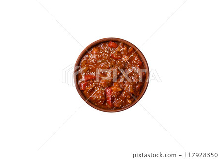Thai Asian dish with meat, hot pepper, tomato sauce and sesame Thai Asian dish with meat, hot pepper, tomato sauce and sesame 117928350