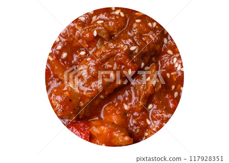 Thai Asian dish with meat, hot pepper, tomato sauce and sesame Thai Asian dish with meat, hot pepper, tomato sauce and sesame 117928351