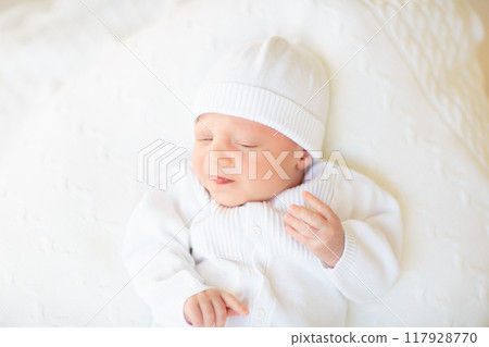 Little baby on white bed Little baby on white bed 117928770