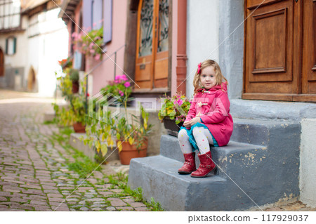Kids in historical city center in France Kids in historical city center in France 117929037