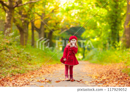 Little girl in autumn park Little girl in autumn park 117929052