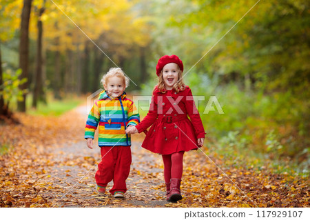 Kids playing in autumn park 117929107