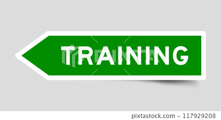 Green color arrow shape sticker label with word training on gray background 117929208