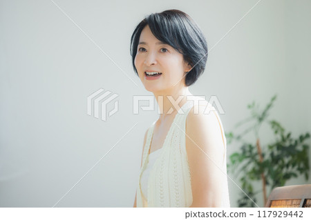 Middle-aged woman doing skin care 117929442