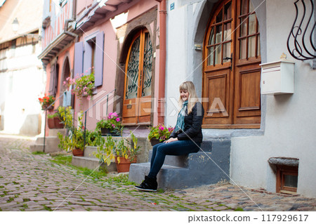 Young woman in historical city center in France 117929617