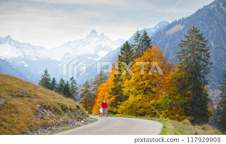 Family with kids hiking in the mountains 117929908