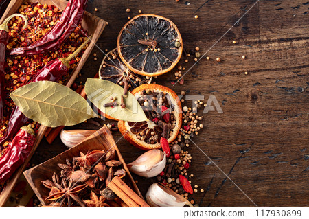 Various spices on a kitchen table. 117930899