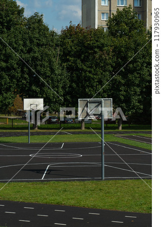 Basketball fields at the school stadium. Basketball Rings Basketball fields at the school stadium. Basketball Rings 117930965