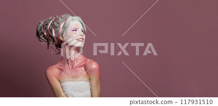 Smiling beautiful woman in carnival Halloween costume, theater actress Smiling beautiful woman in carnival Halloween costume, theater actress 117931510