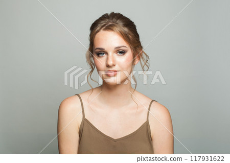 Beauty fashion portrait of elegance woman with fresh skin, updo hair and makeup Beauty fashion portrait of elegance woman with fresh skin, updo hair and makeup 117931622
