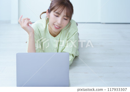 A young woman creating documents on a computer A young woman creating documents on a computer 117933307