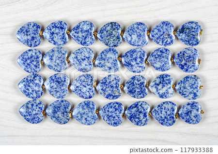 Blue Serenity: Artful Display of 28 Sodalite Hearts Combines Geometric Precision with Natural Beauty. Blue Serenity: Artful Display of 28 Sodalite Hearts Combines Geometric Precision with Natural Beauty. 117933388