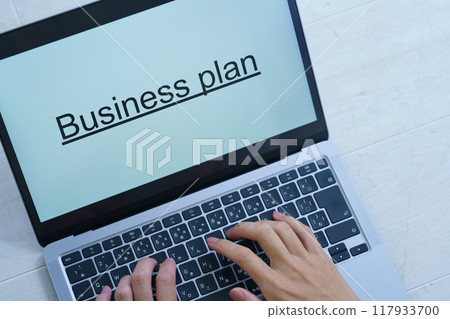 A young woman creating documents on a computer A young woman creating documents on a computer 117933700