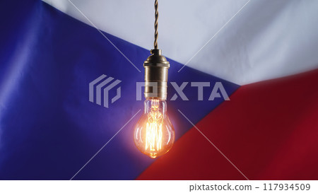 Edison light bulb on czech flag background. Bad electricity supply, problems, energy crisis in Czech Edison light bulb on czech flag background. Bad electricity supply, problems, energy crisis in Czech 117934509