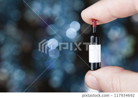 image of miniature wine bottle dark background 117934692