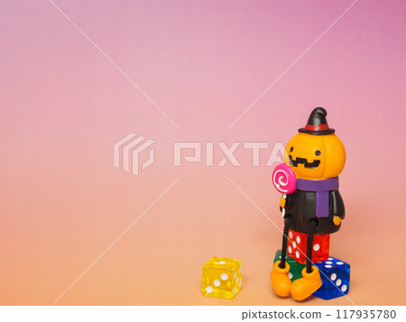 Pumpkin sitting on a dice Pumpkin sitting on a dice 117935780