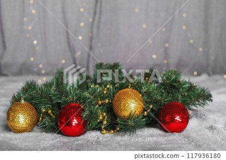 Merry Christmas and Happy New Year greeting card. New Year wreath with red and yellow Christmas tree balls Merry Christmas and Happy New Year greeting card. New Year wreath with red and yellow Christmas tree balls 117936180