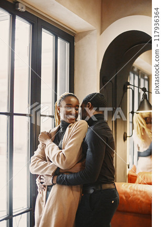 Two young people in cafe. African couple enjoying the time spending with each other. Two young people in cafe. African couple enjoying the time spending with each other. 117936364