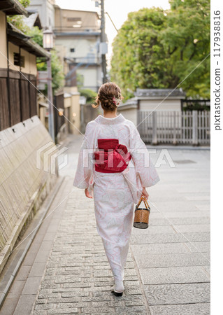 A woman in a kimono A woman in a kimono 117938816